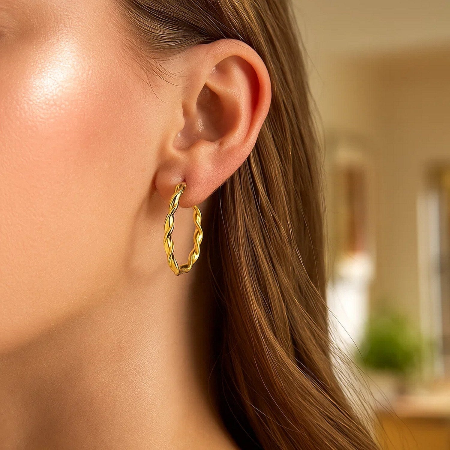 14k yellow gold modern hoop earrings, elegantly designed, showcasing a sleek 25mm profile for timeless luxury.