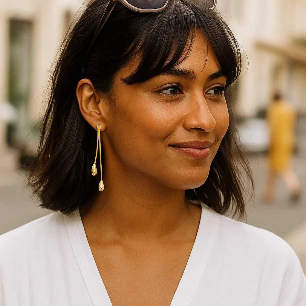 14k yellow gold polished double drop earrings with elegant stud design, showcasing a refined and luxurious style.