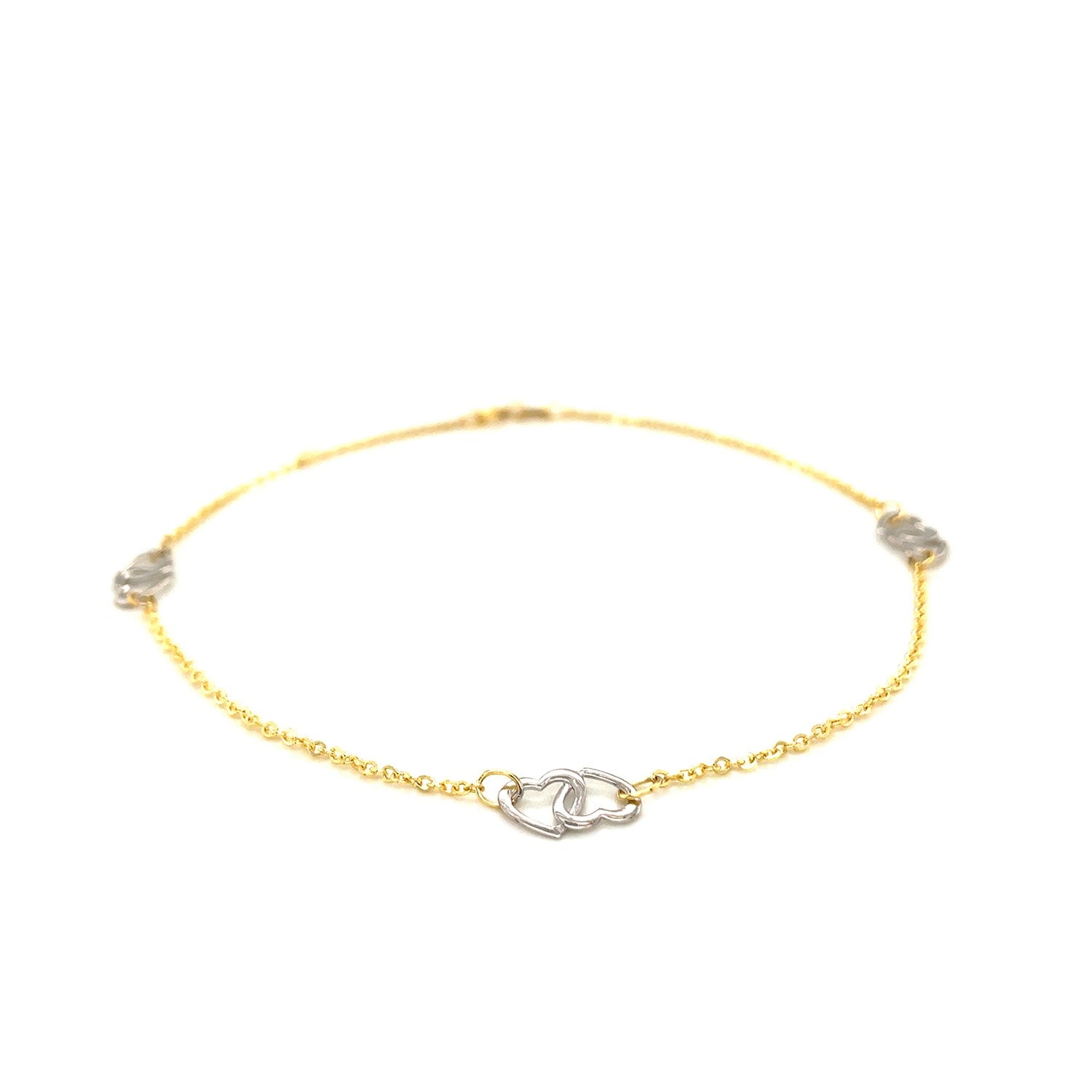 14k two-tone gold entwined heart anklet with modern design, showcasing luxurious craftsmanship and elegant style.