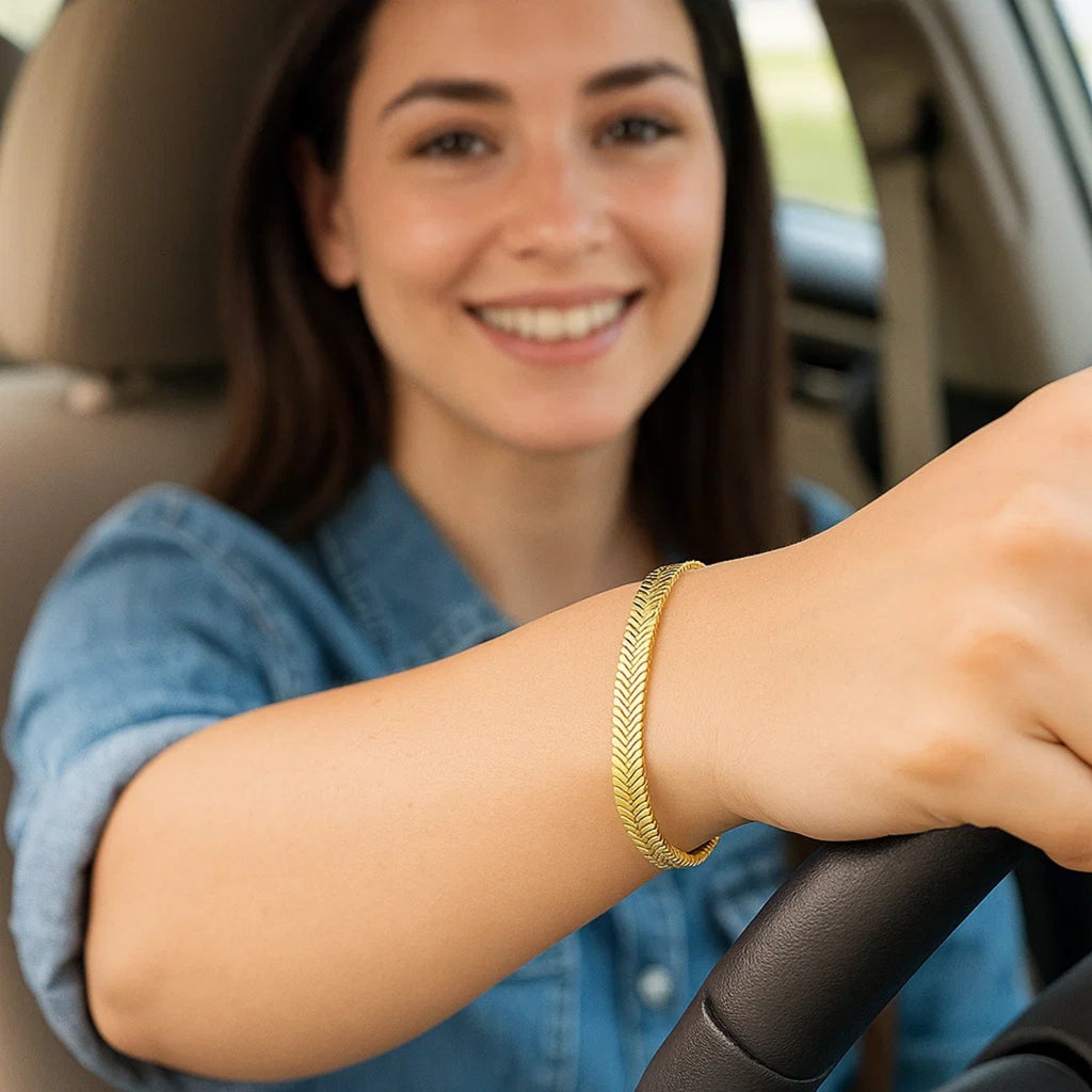 14k yellow gold oval snake chain bracelet with a modern design, showcasing a sleek and elegant silhouette.