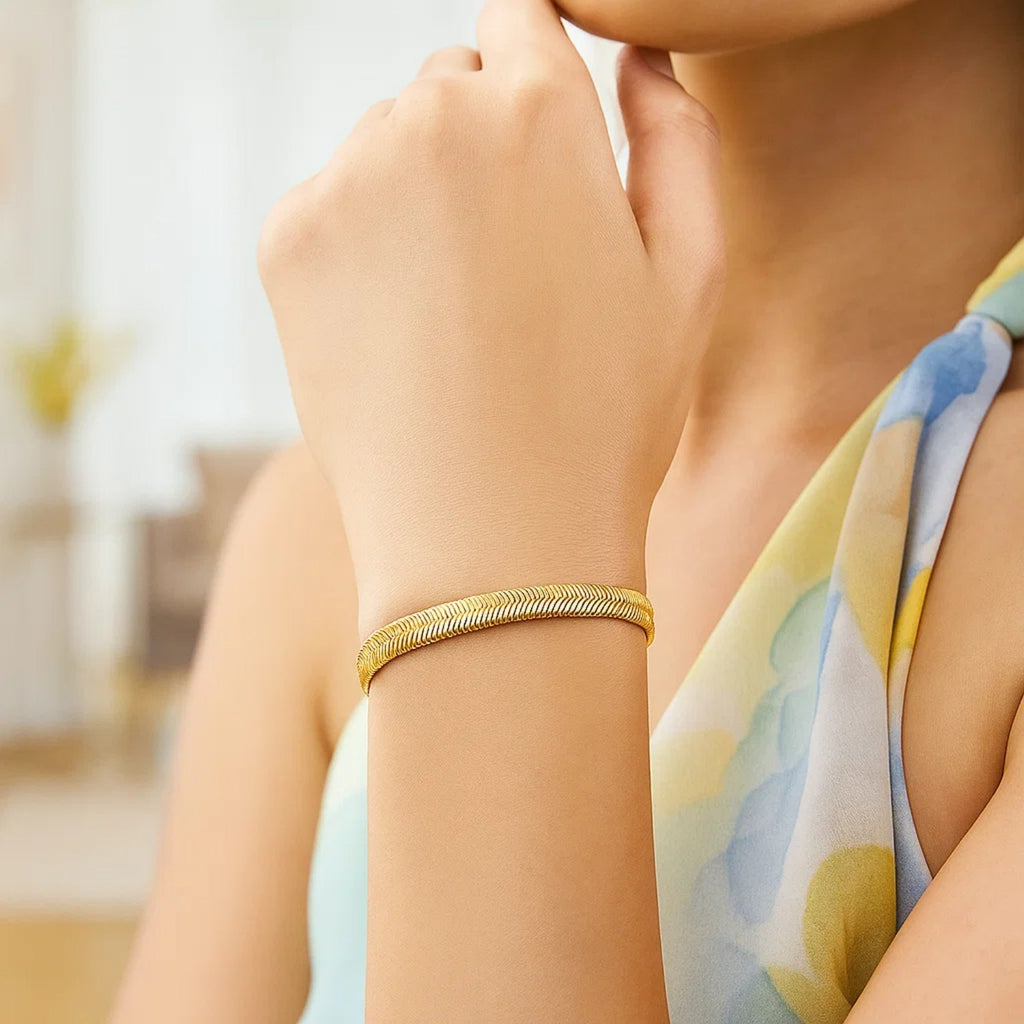 14k yellow gold oval snake chain bracelet with a modern design, showcasing a sleek 5.30 mm width for elegant wear.