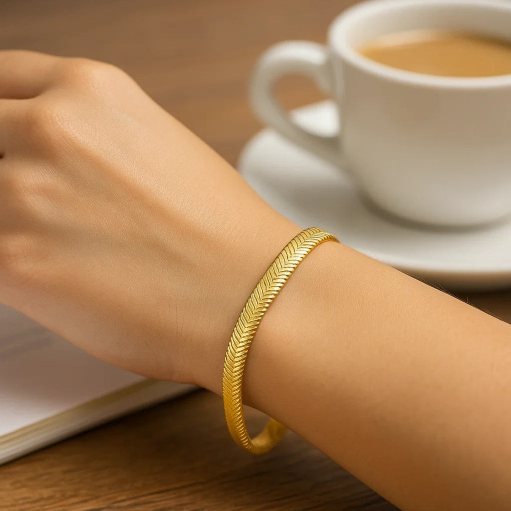 14k yellow gold oval snake chain bracelet with a modern design, featuring a sleek 5.30 mm width for elegant wear.