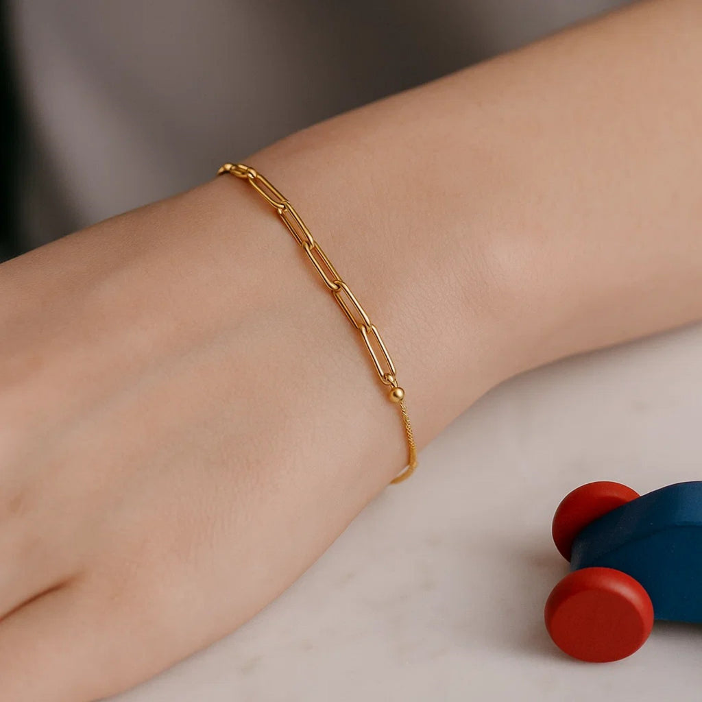 14K yellow gold adjustable bracelet featuring a modern paperclip chain design, perfect for elegant layering.
