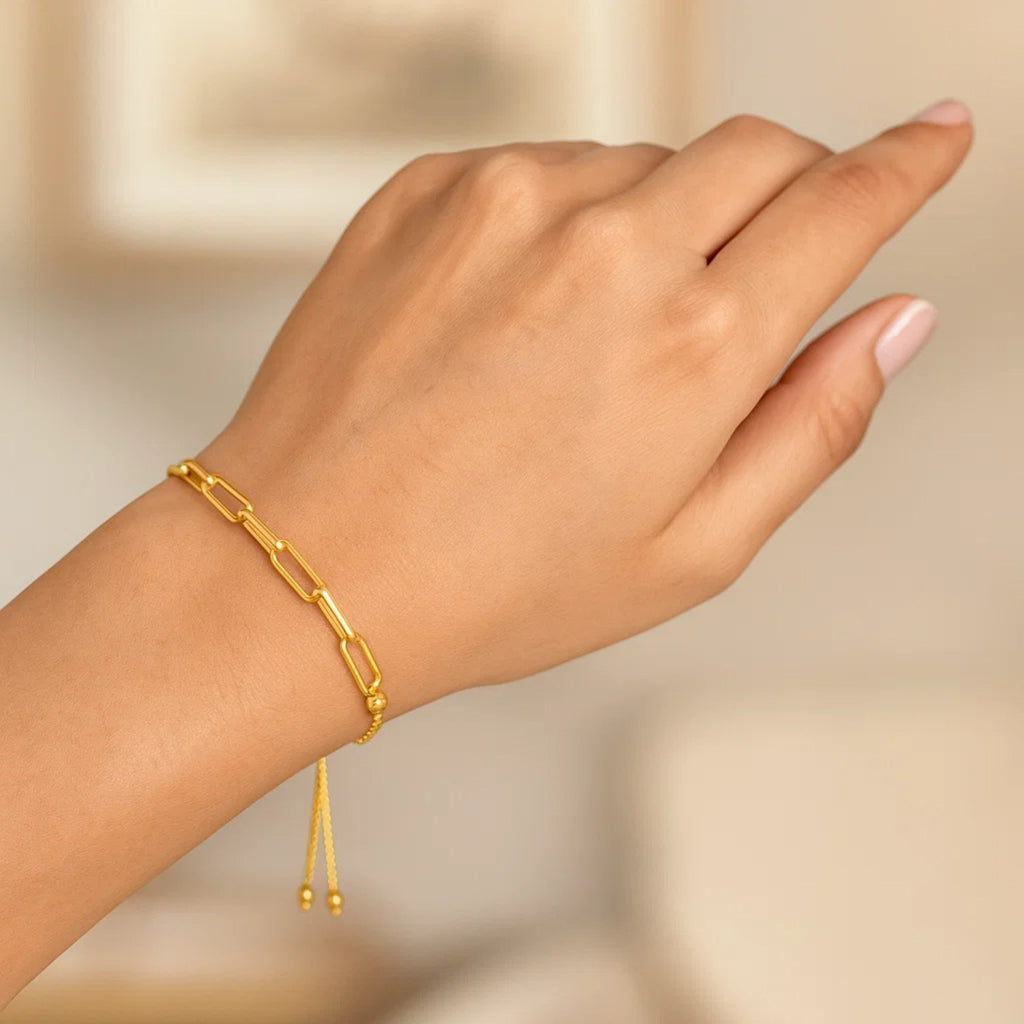 14K yellow gold adjustable bracelet featuring a modern paperclip chain design, perfect for elegant layering.
