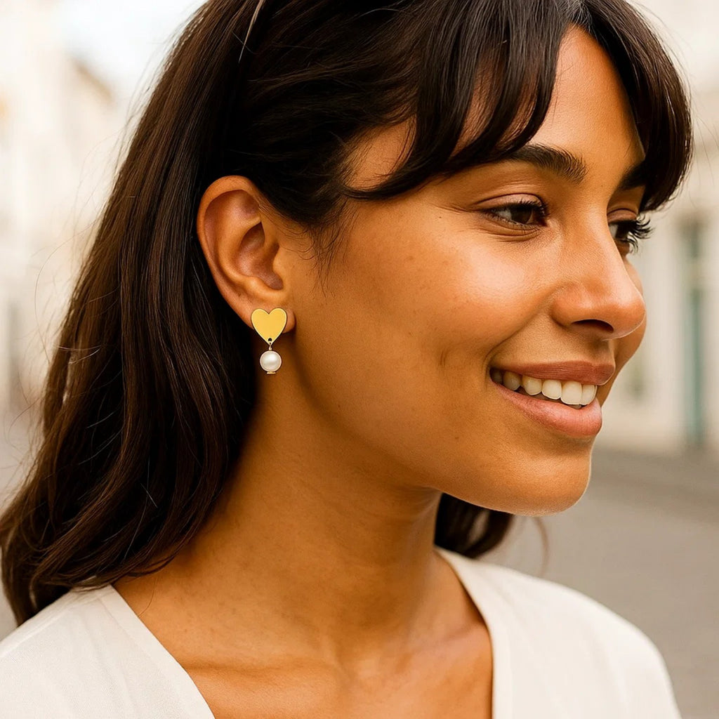 14k yellow gold pearl drop stud earrings featuring elegant round design for a timeless luxury look.