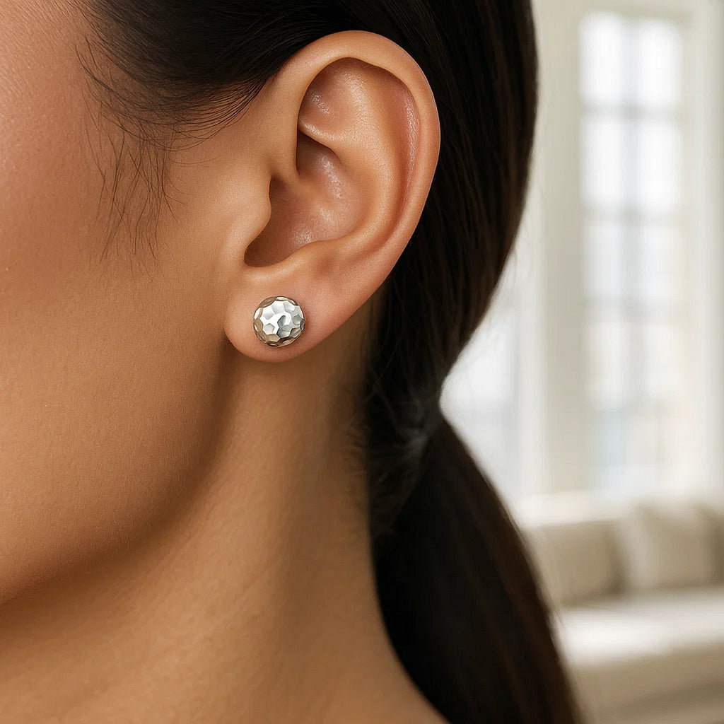 14k white gold modern faceted stud earrings featuring a sleek round design for timeless elegance.