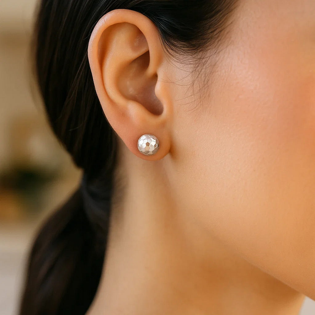 14k white gold modern faceted stud earrings featuring a sleek round design for a timeless elegance.