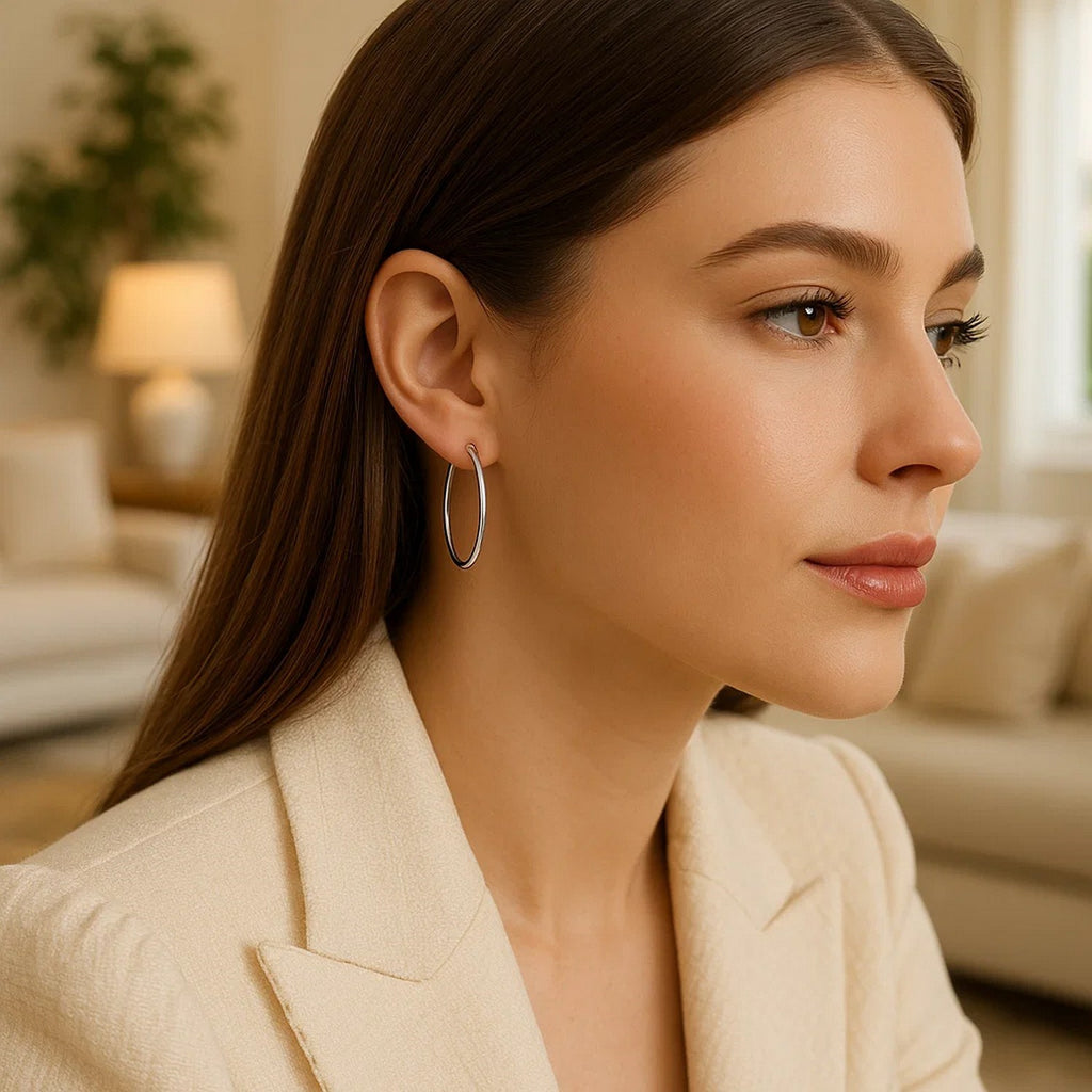 14k white gold polished hoop earrings showcasing a sleek minimalist design, perfect for elegant everyday wear.
