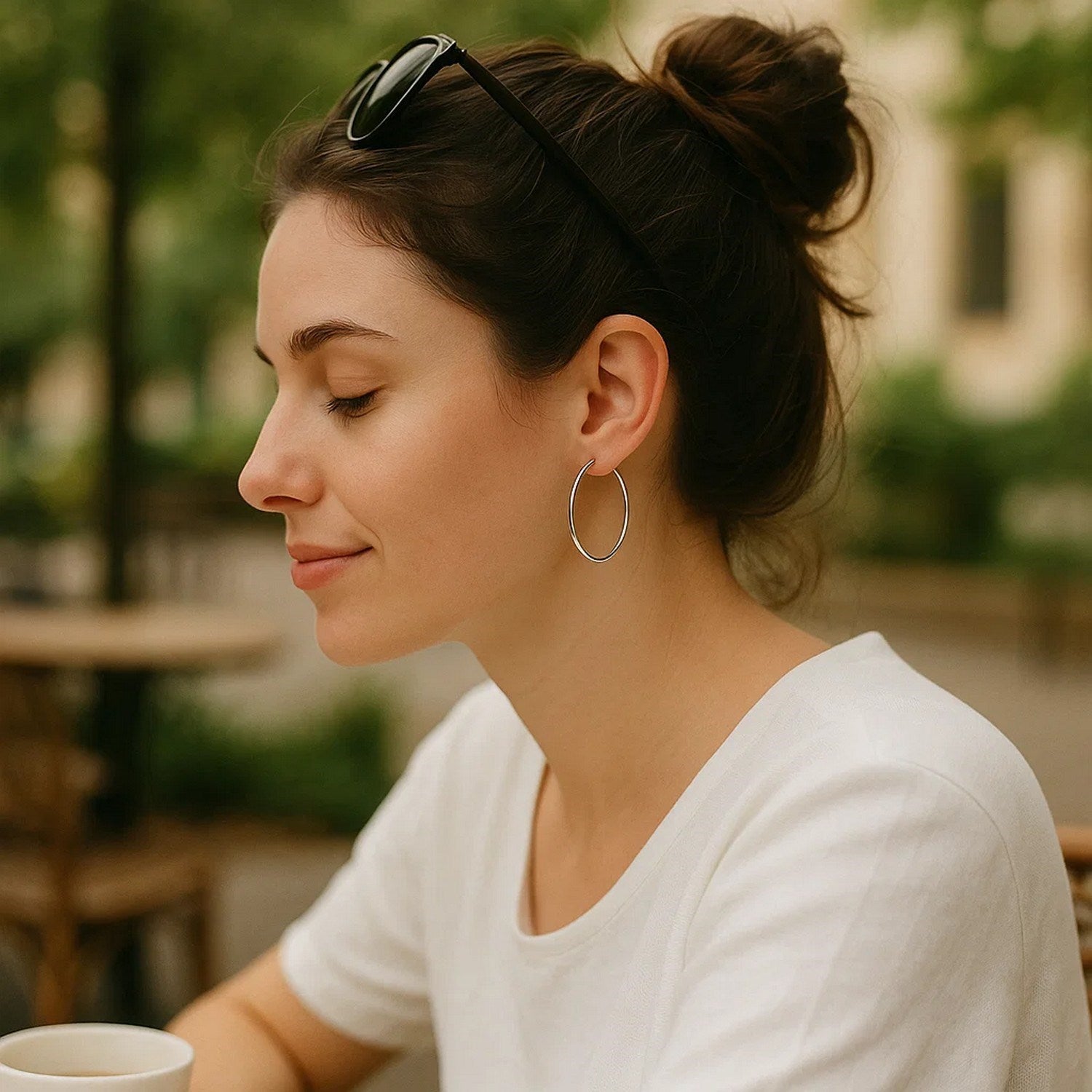 14k white gold polished hoop earrings with a sleek minimalist design, perfect for elegant everyday wear.