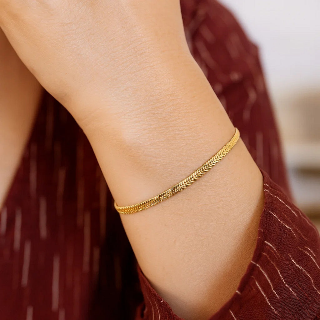 Elegant 14k yellow gold oval snake chain bracelet, 2.60 mm, showcasing a refined and luxurious design.