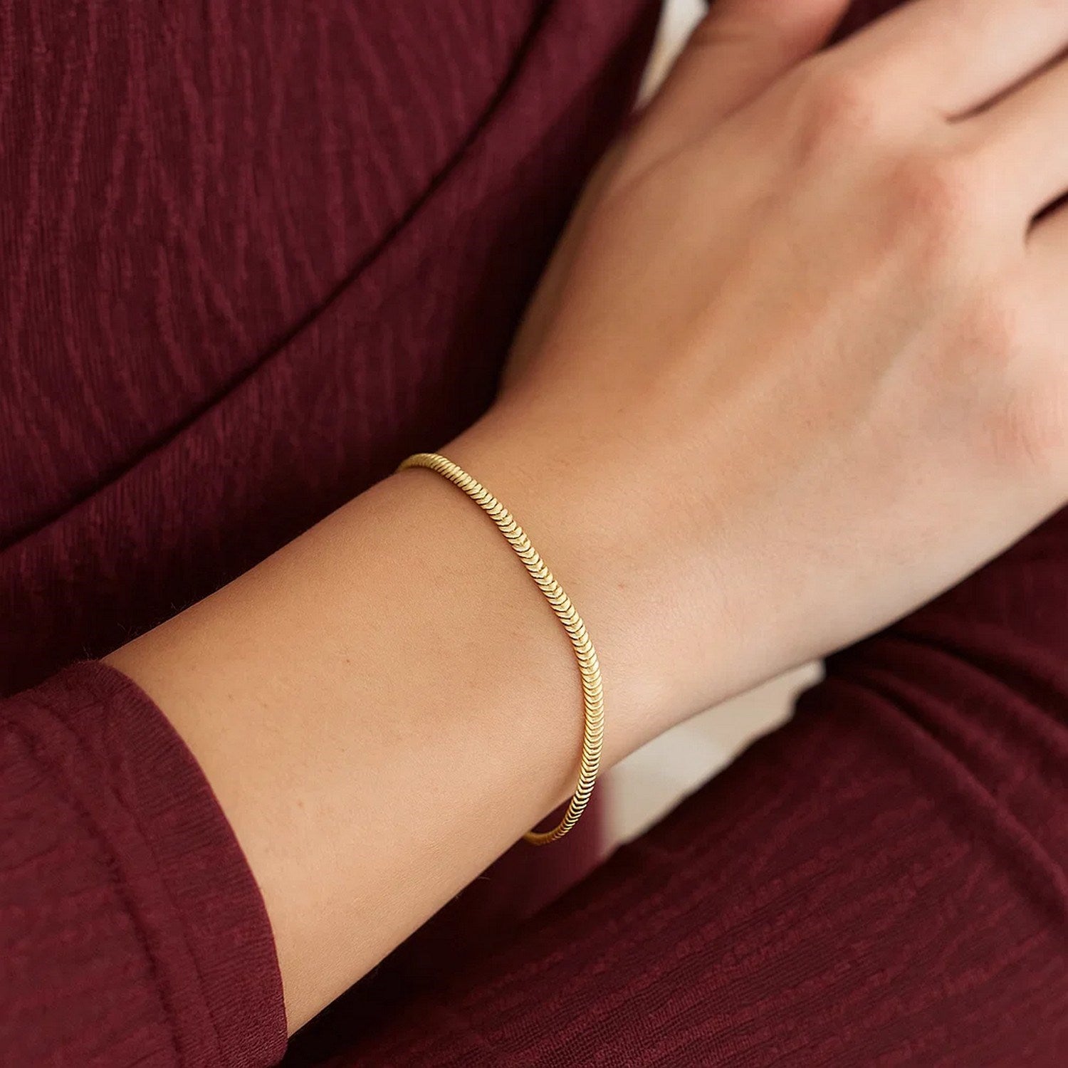 14K yellow gold oval snake chain bracelet, elegantly designed with a smooth, refined finish for timeless luxury.