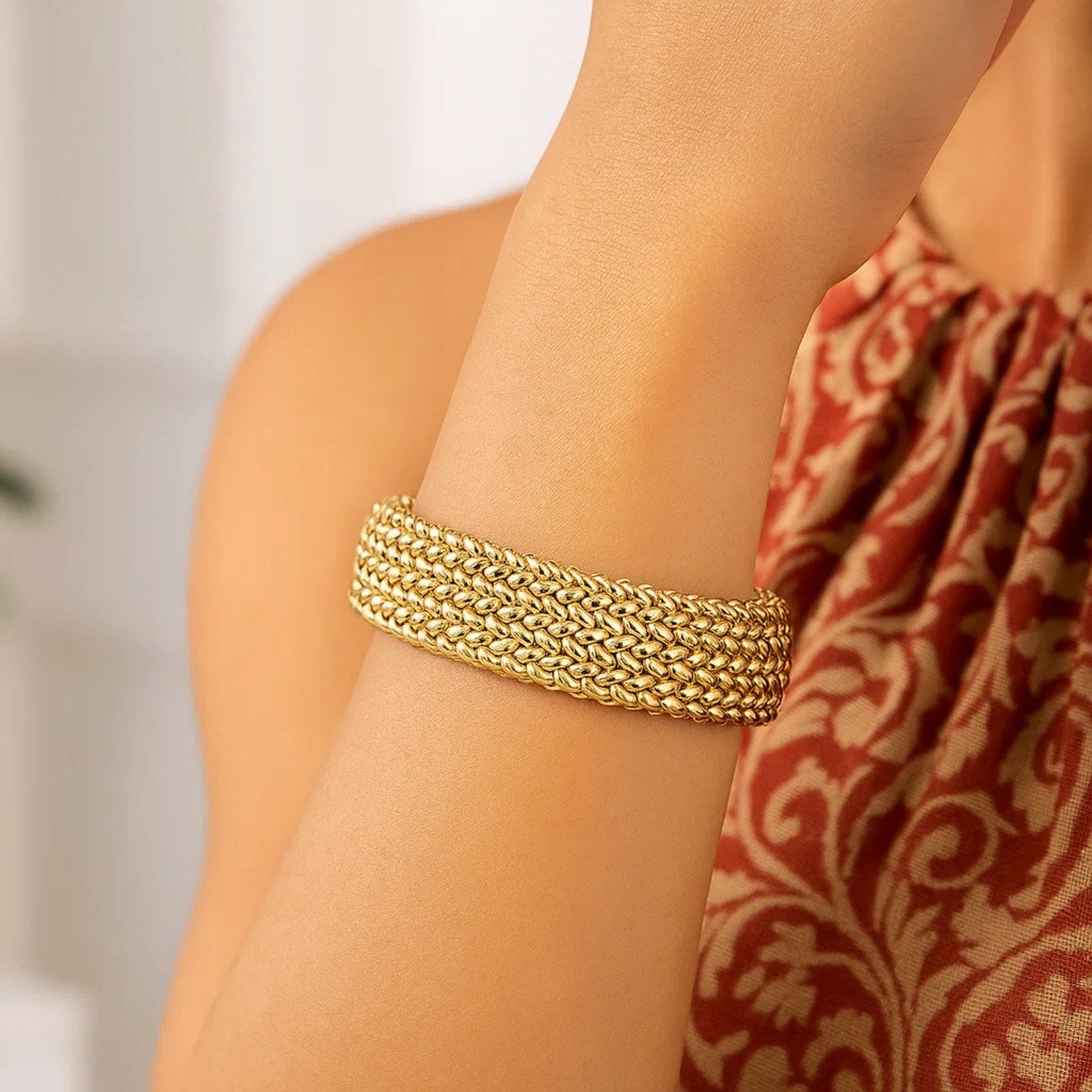 14k yellow gold high polish thick braided bracelet, modern luxury design, 14.50 mm width, perfect for elegant styling.