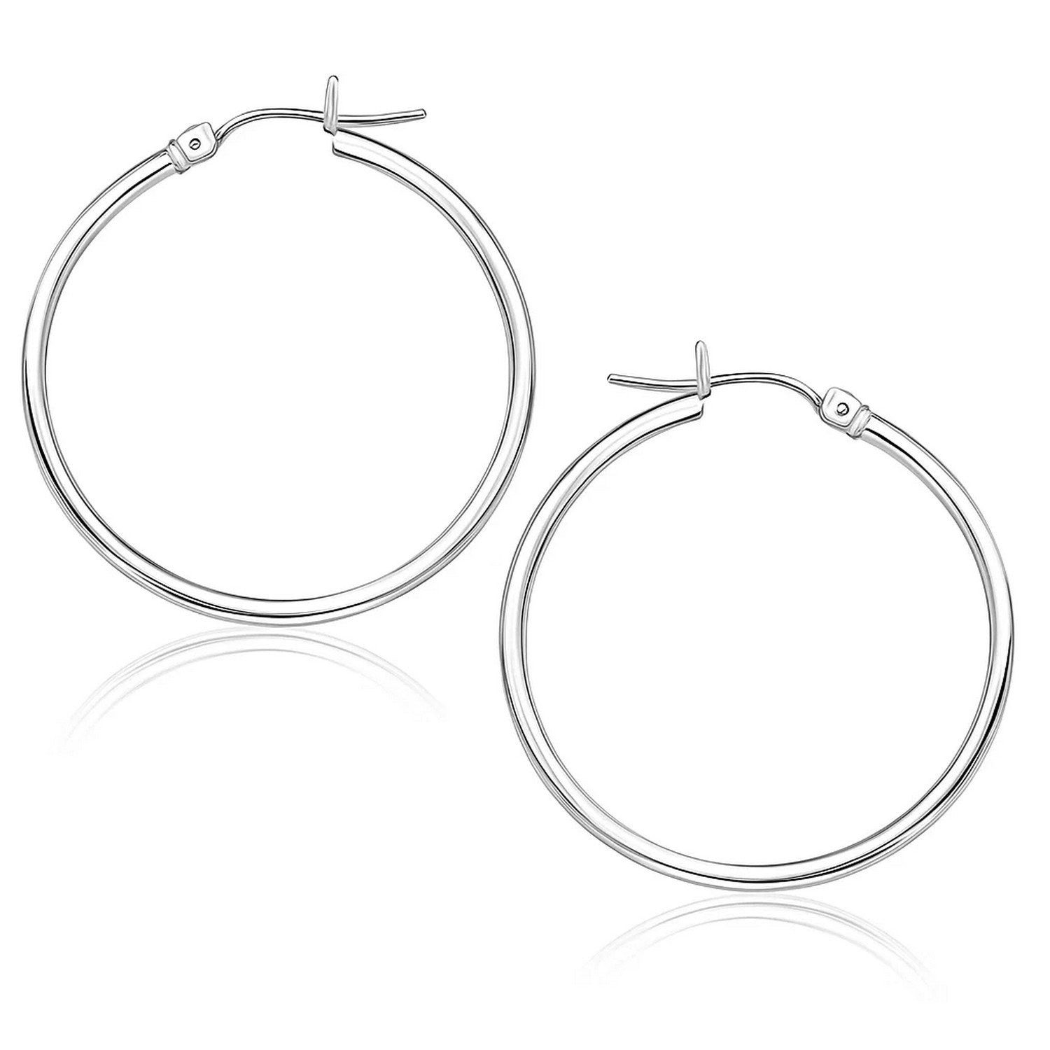 Polished 10k white gold hoop earrings, minimalist design, crafted from luxurious 14k gold for timeless elegance.