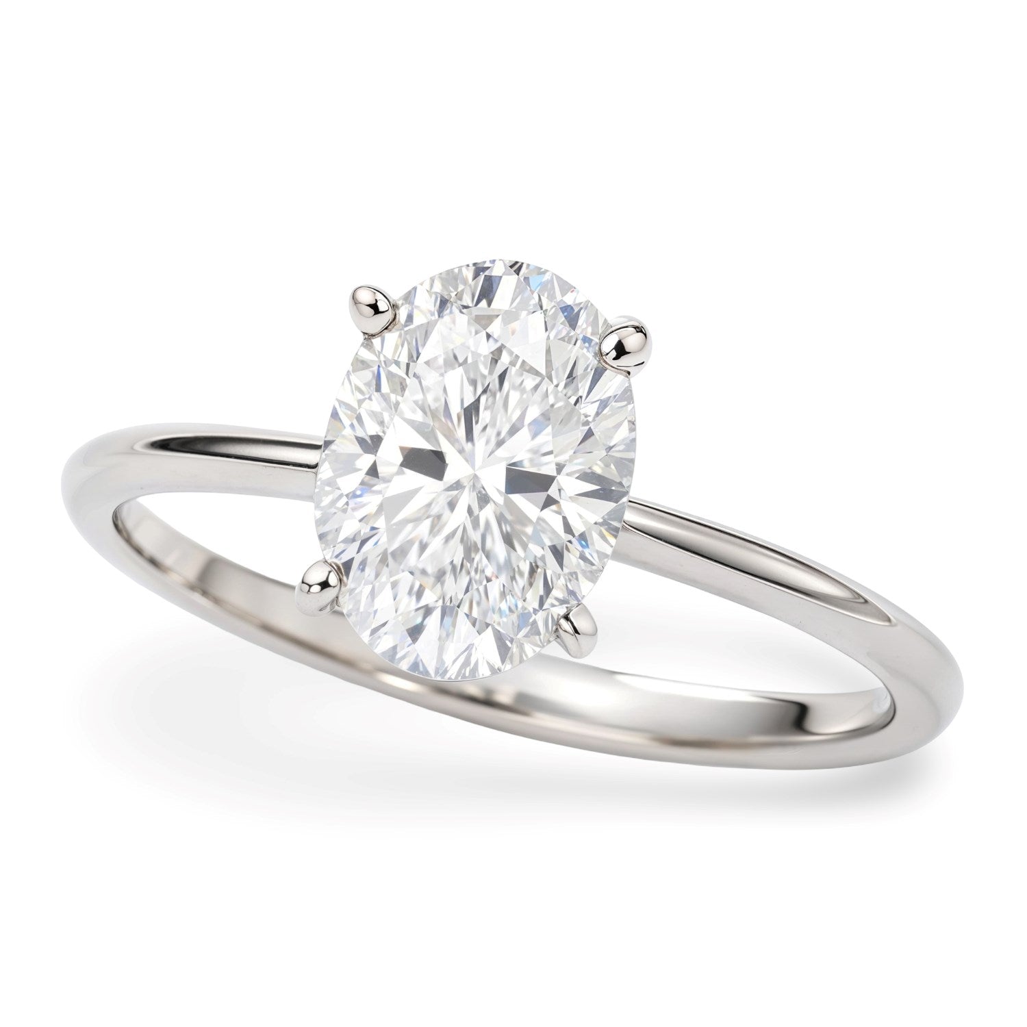 1 1/2 carat oval lab-grown diamond solitaire ring in 10K white gold with elegant prong setting, modern luxury design.