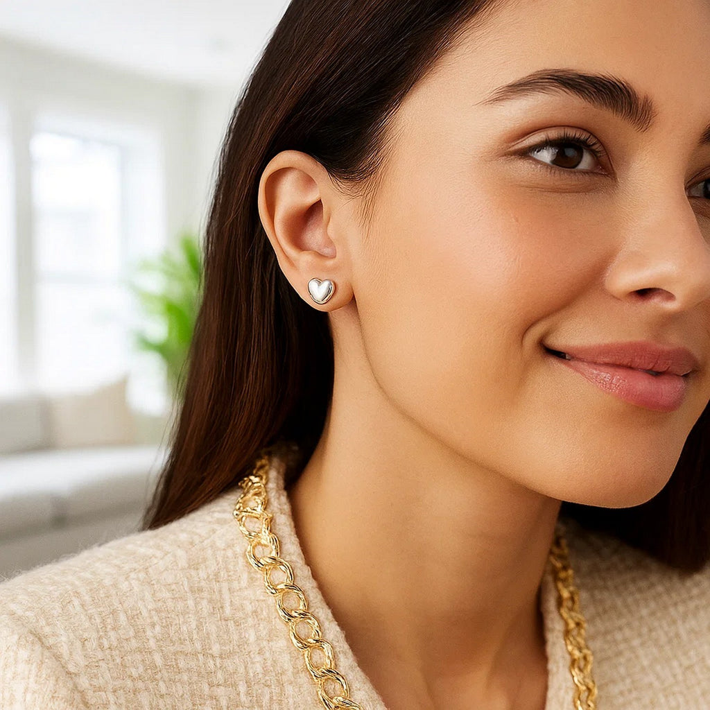 Polished 14k white gold puffed heart earrings with a minimalist design, perfect for elegant occasions.