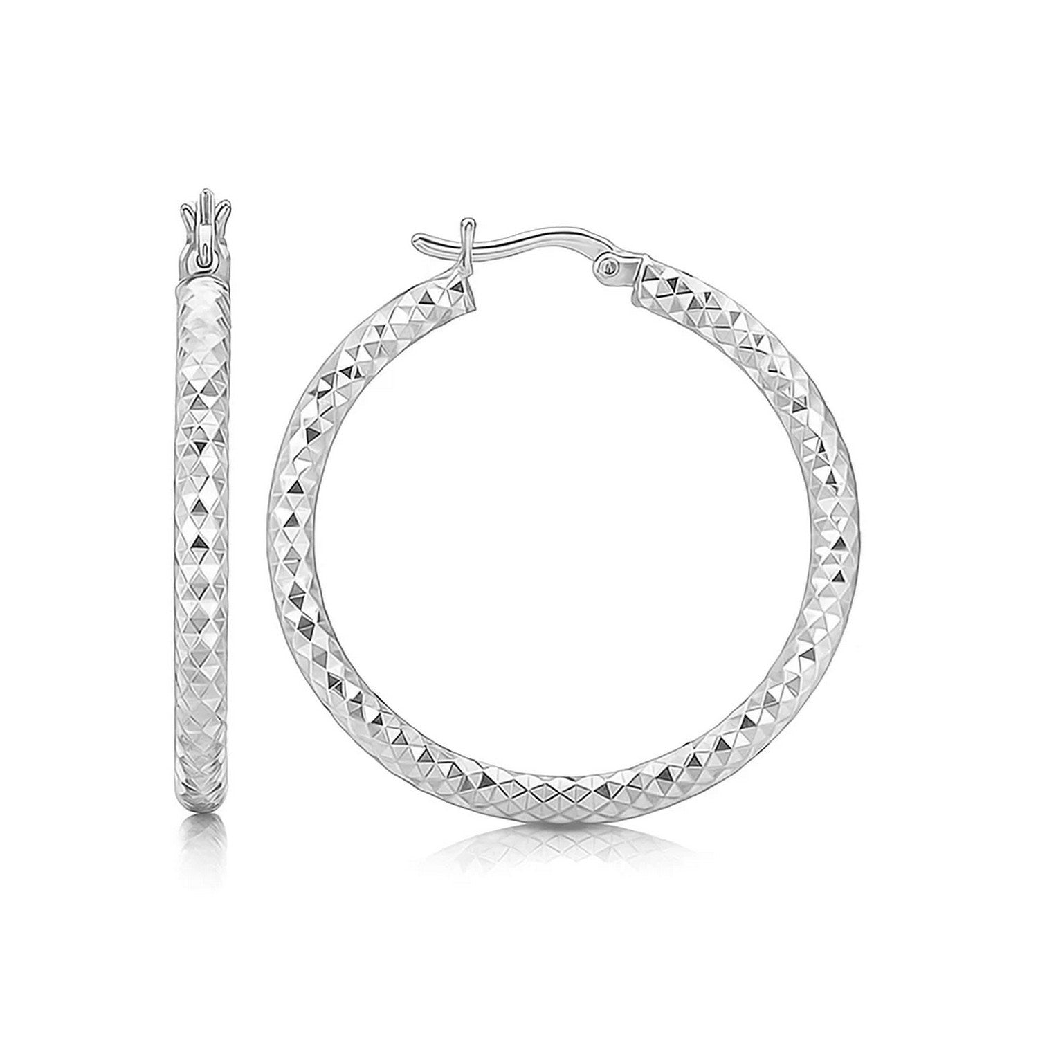 Sterling silver faceted hoop drop earrings with rhodium plating, showcasing modern elegance and refined craftsmanship.