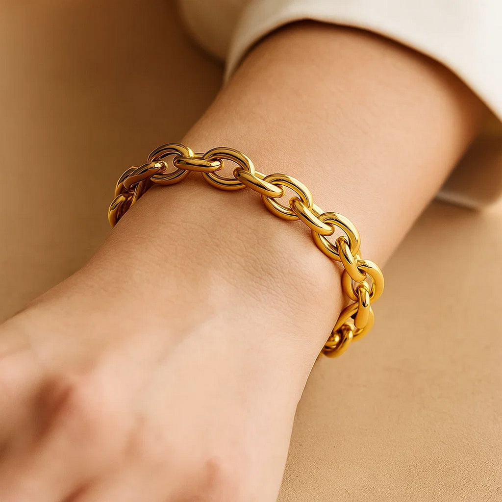14k yellow gold polished cable link bracelet showcasing a modern design with elegant, interconnected links.