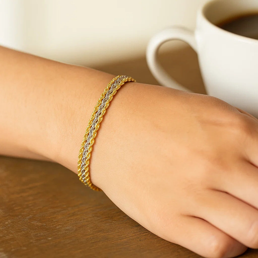 Triple strand rope chain bracelet in 10k two-tone gold, featuring modern design and luxurious 14k gold craftsmanship.
