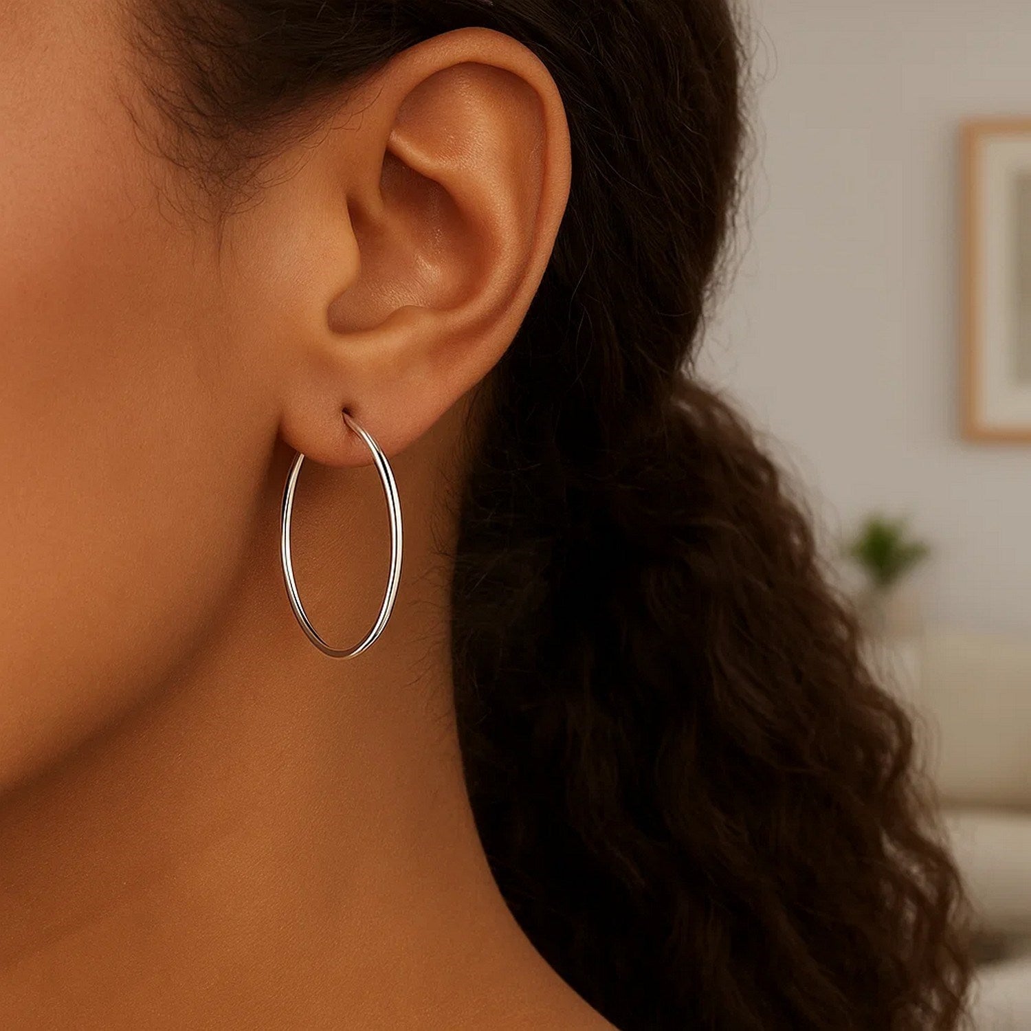 Elegant 10k white gold polished hoop earrings crafted from 14k gold, showcasing a timeless and sophisticated design.