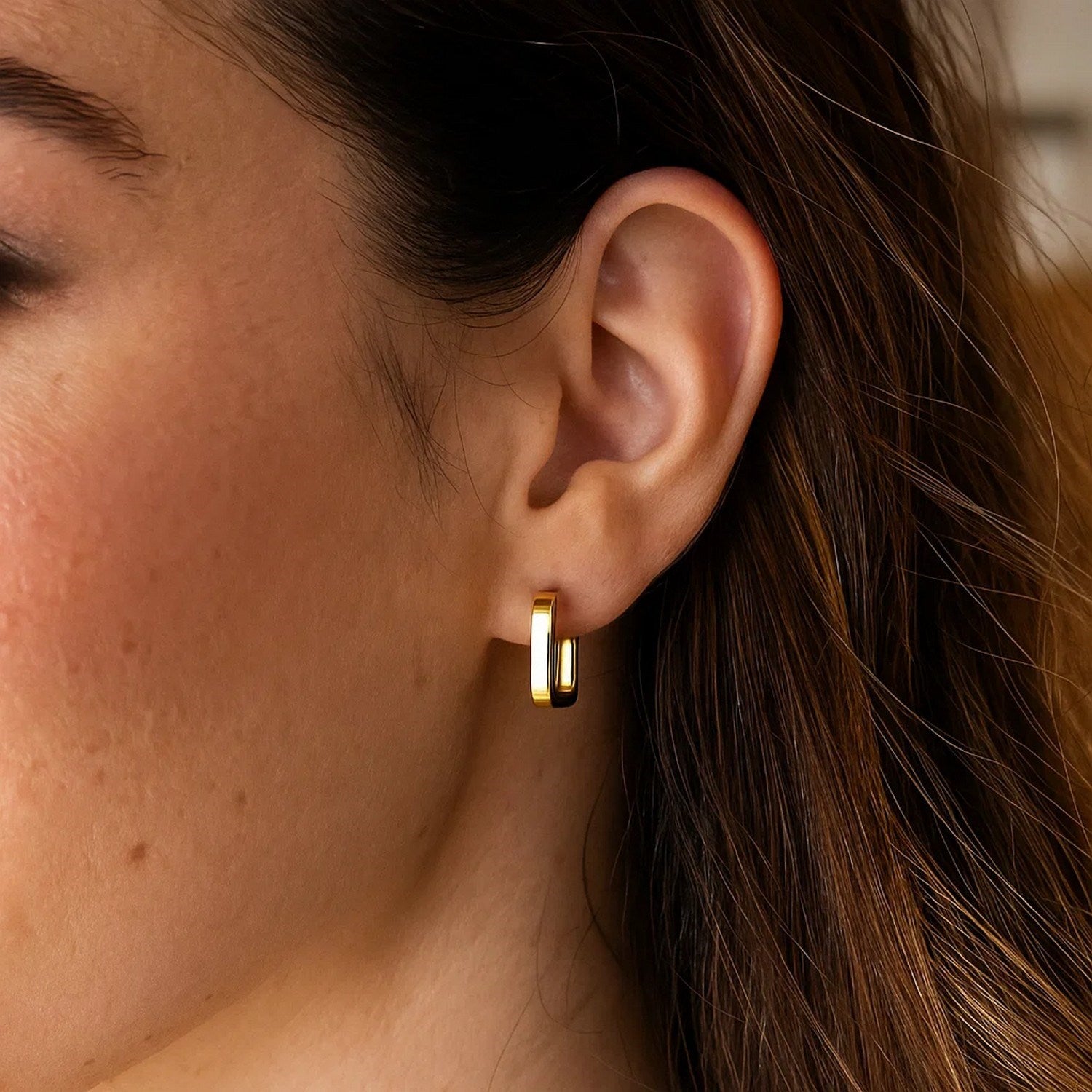 14k yellow gold small square huggie earrings with a sleek modern design, perfect for everyday elegance.