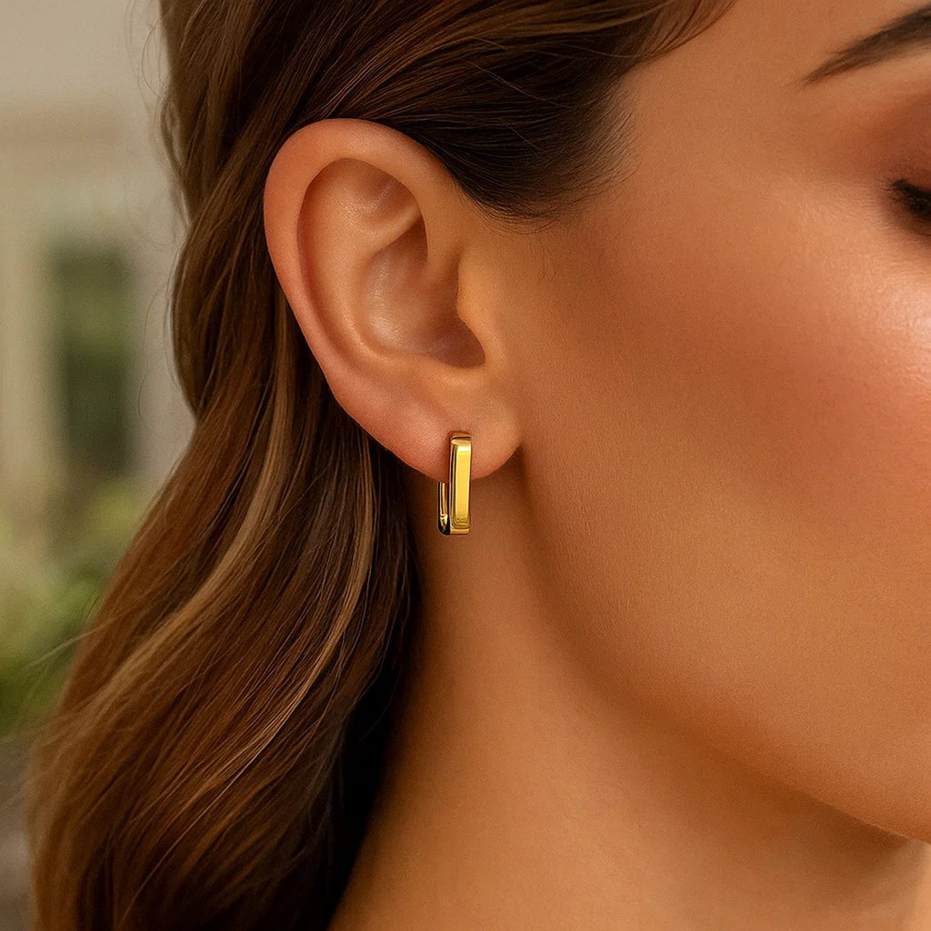 14k yellow gold small square huggie earrings with a modern design, perfect for everyday elegance and effortless style.