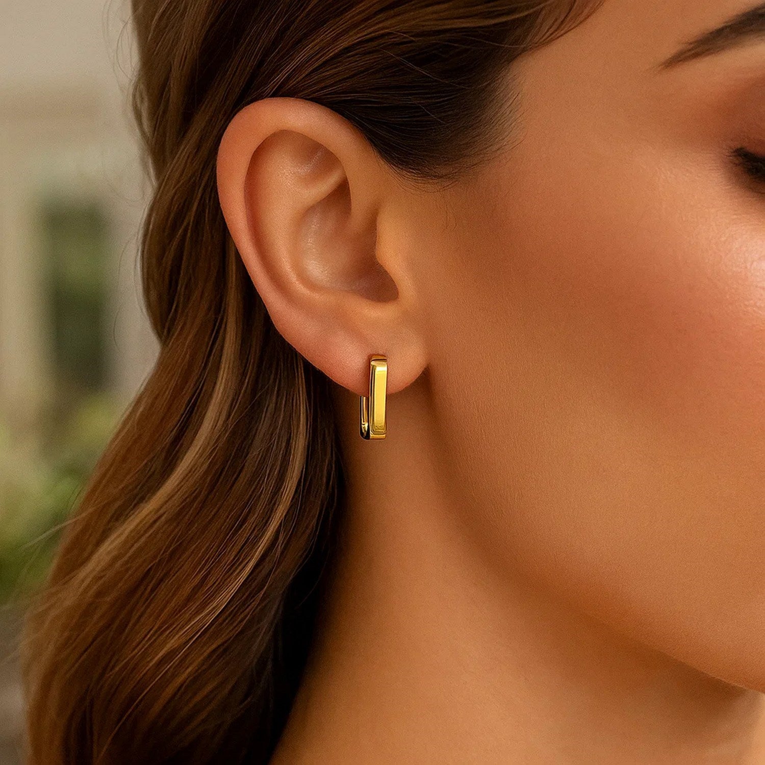 14k yellow gold small square huggie earrings with a modern design, perfect for everyday elegance and effortless style.