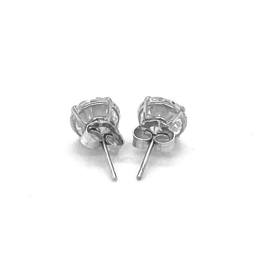 14k white gold modern stud earrings featuring faceted cubic zirconia in elegant prong settings.