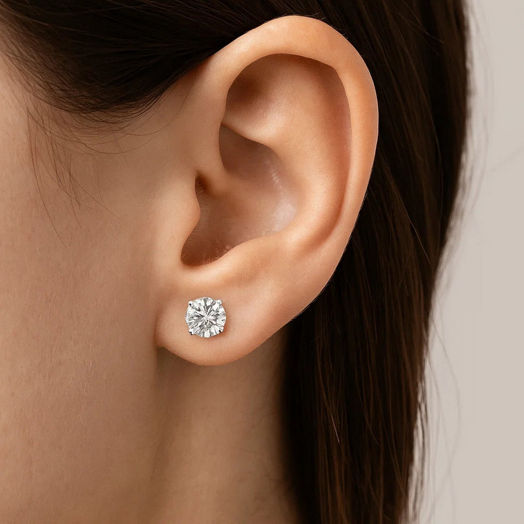 14k white gold faceted cubic zirconia stud earrings in modern prong setting, showcasing exquisite brilliance and elegance.