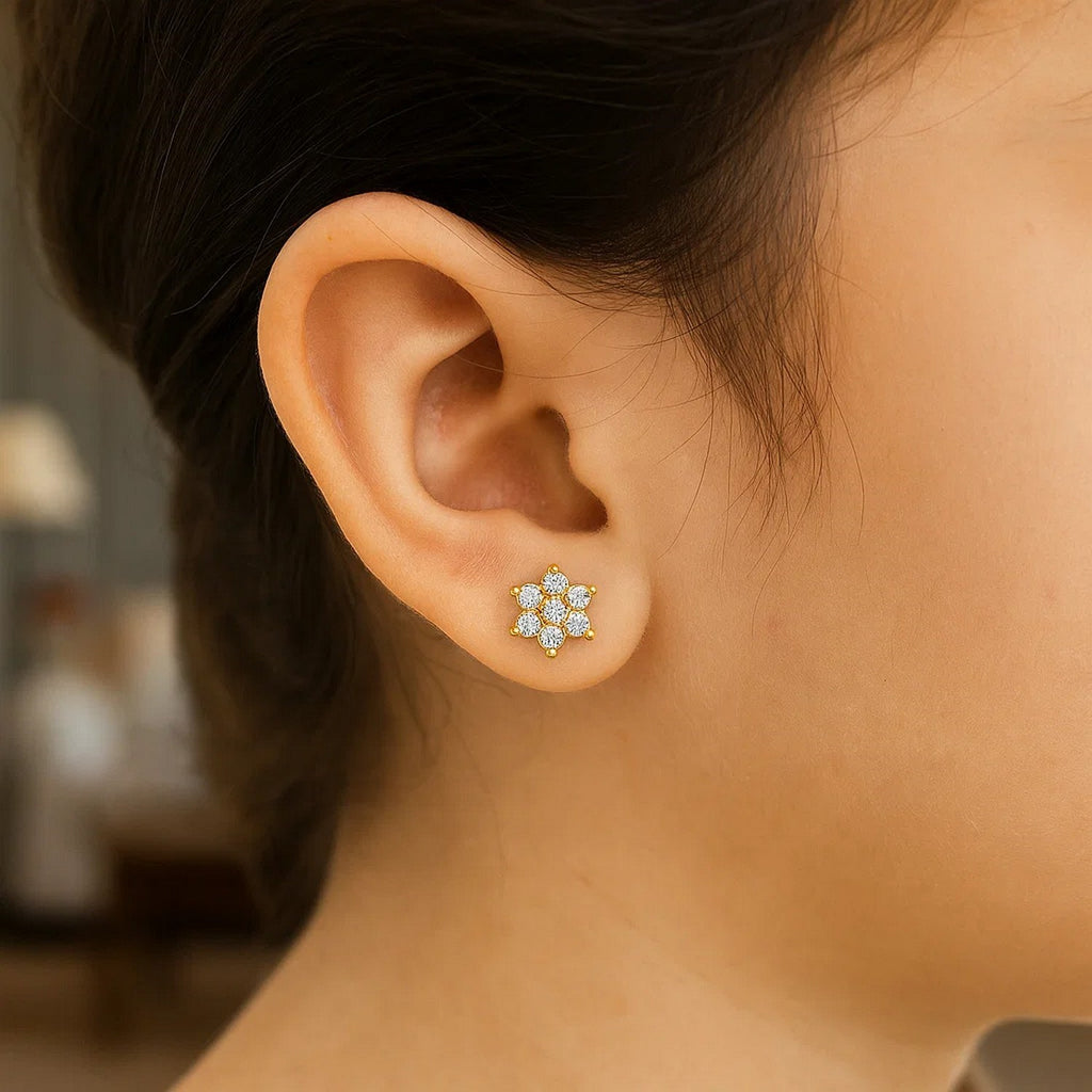 14k yellow gold floral stud earrings for children, featuring a modern design and secure stud backing.