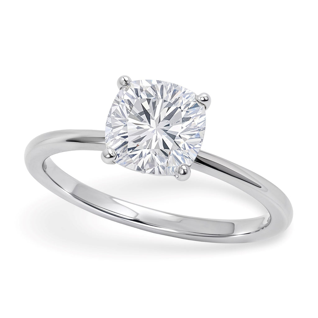1 1/2 carat cushion lab-grown diamond solitaire ring in 14k white gold with elegant prong setting, classic design.