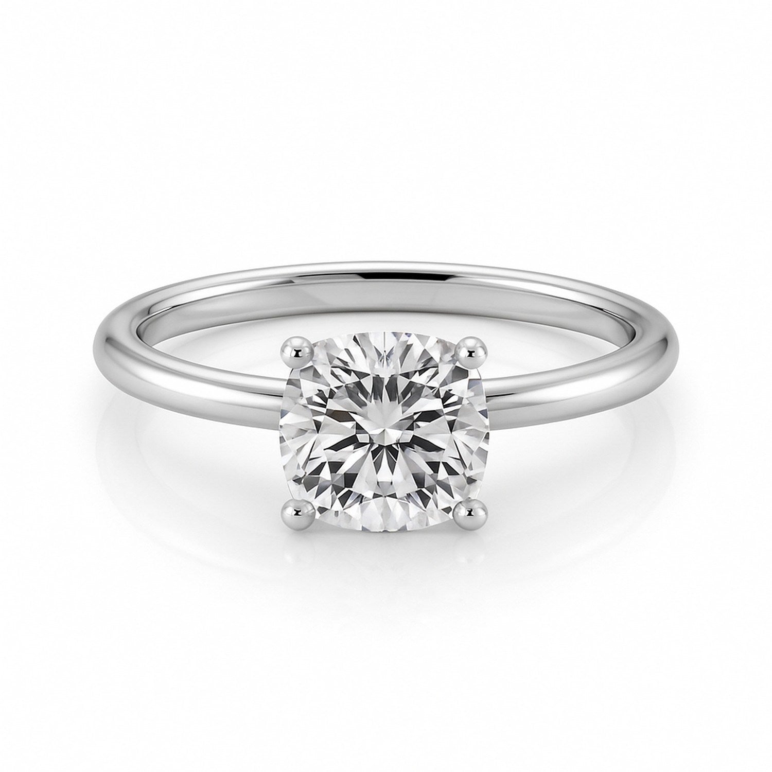 14k white gold solitaire ring featuring a 1 1/2 carat cushion lab-grown diamond in a classic prong setting