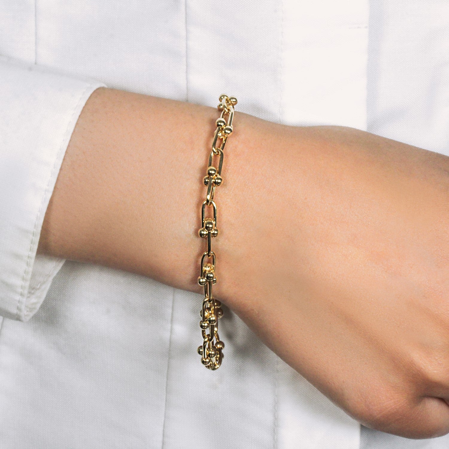 14k yellow gold modern Jax chain bracelet featuring a sleek round link design, 7 1/2 inches in length.