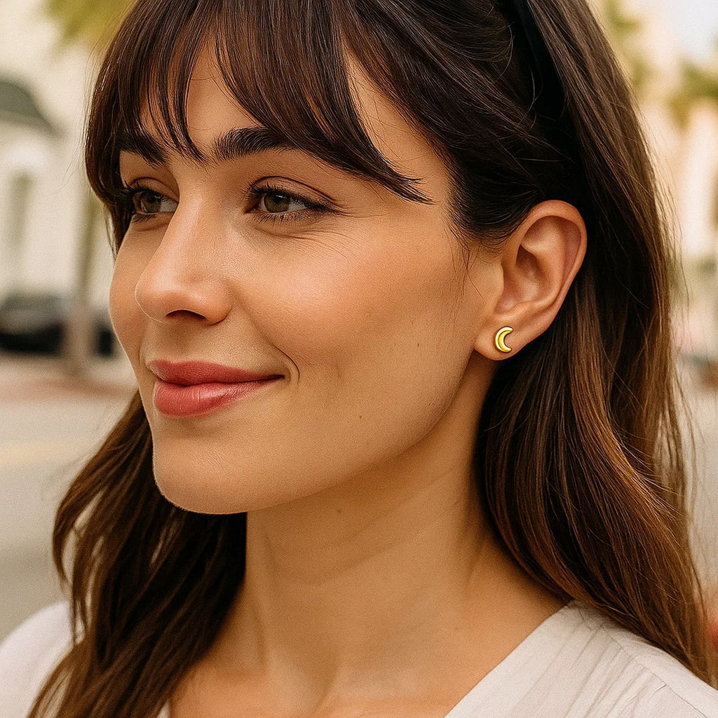 14k yellow gold minimalist moon post earrings, elegantly crafted for a luxurious touch to any outfit.