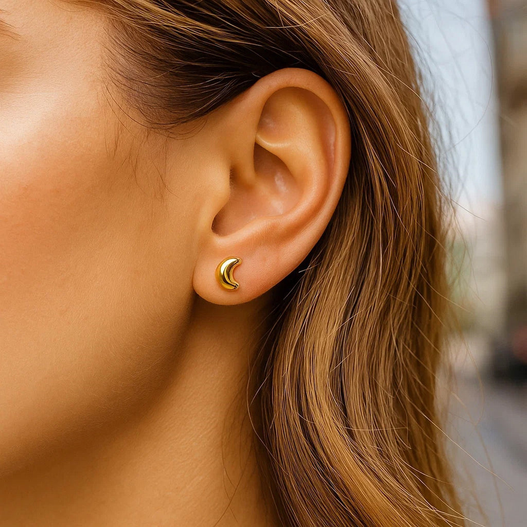 14k yellow gold minimalist moon post earrings showcasing elegant design and luxurious craftsmanship.
