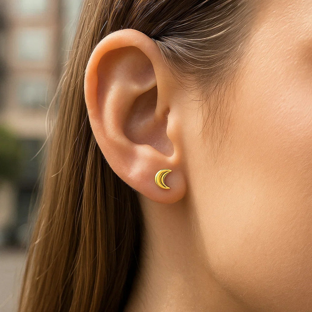 14k yellow gold minimalist moon post earrings showcasing elegant simplicity and luxury craftsmanship.