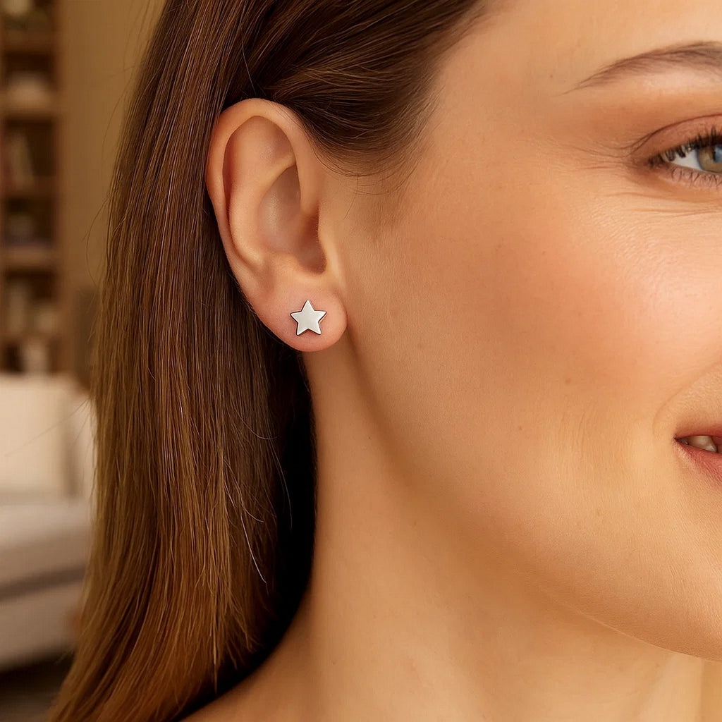 14k white gold modern star post earrings, 6.5mm, embody luxury with a sleek, contemporary design.