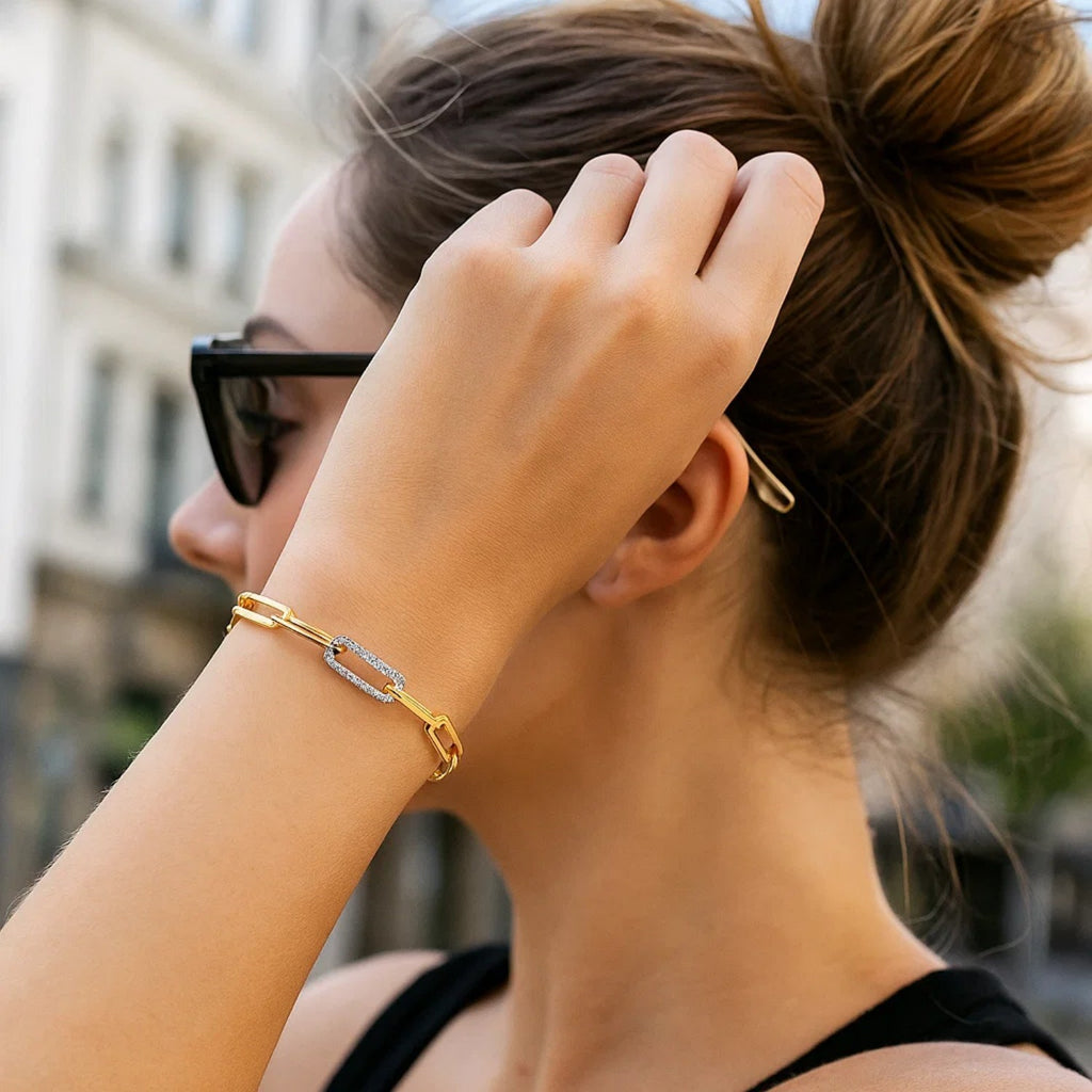 14k yellow gold paperclip chain bracelet featuring three exquisite diamond links for a modern, elegant touch.