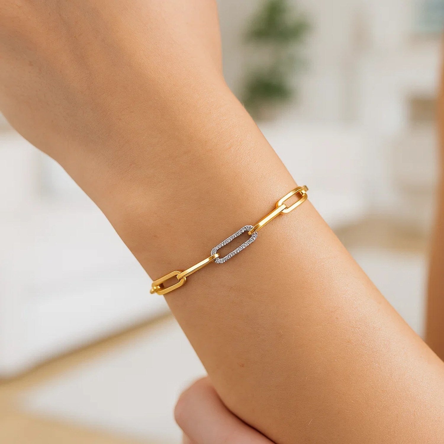 14k yellow gold paperclip chain bracelet featuring three diamond links for a modern, elegant look.