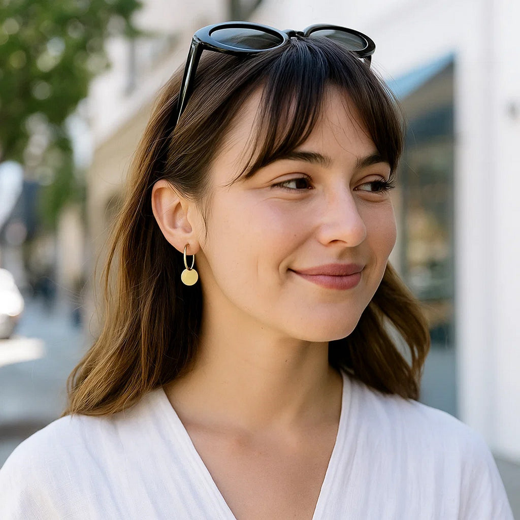 14k yellow gold polished hoop drop earrings with a modern design, showcasing elegance and refined craftsmanship.