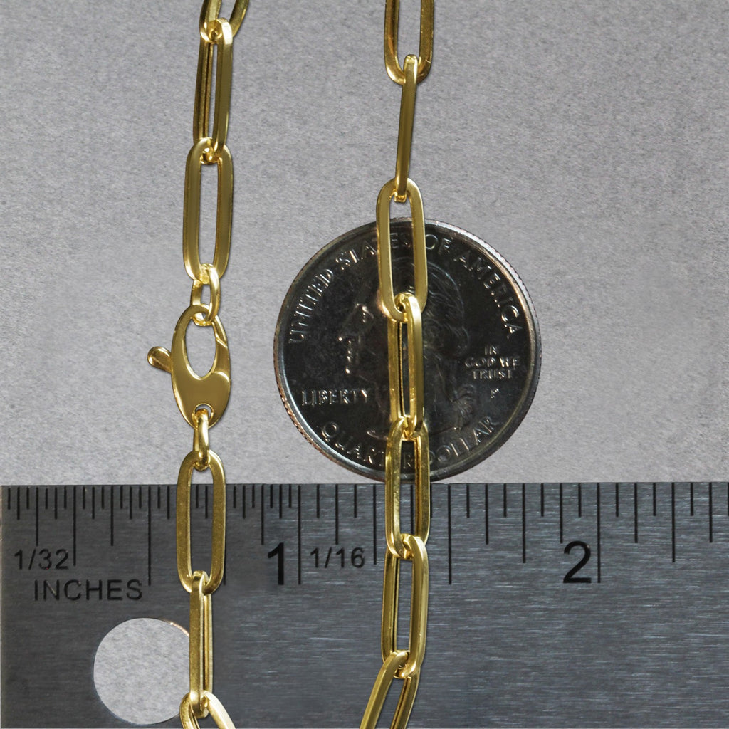 14K yellow gold bold paperclip chain bracelet with modern design and elegant round links, perfect for luxury styling.