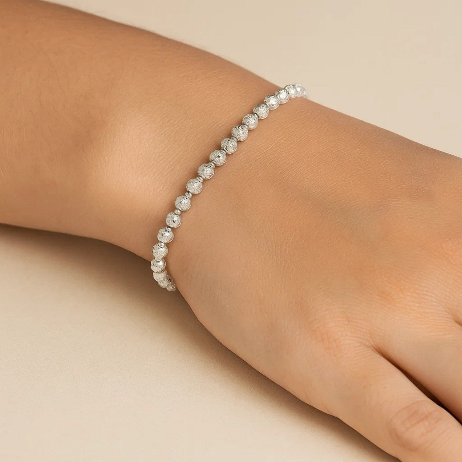 14k white gold disco diamond cut bead bracelet showcasing modern luxury and exquisite craftsmanship.