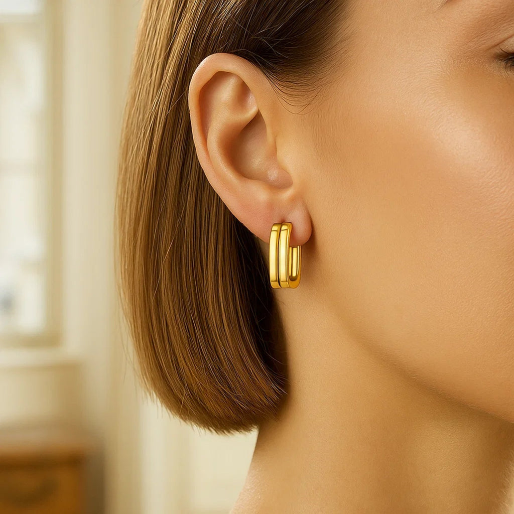 14K yellow gold polished double square tube hoop earrings with a modern design, perfect for elegant occasions.