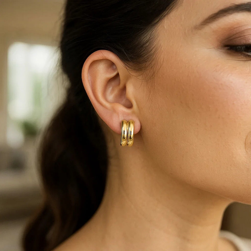 14k yellow gold polished double row C hoop earrings, showcasing a modern design with a luxurious shine.