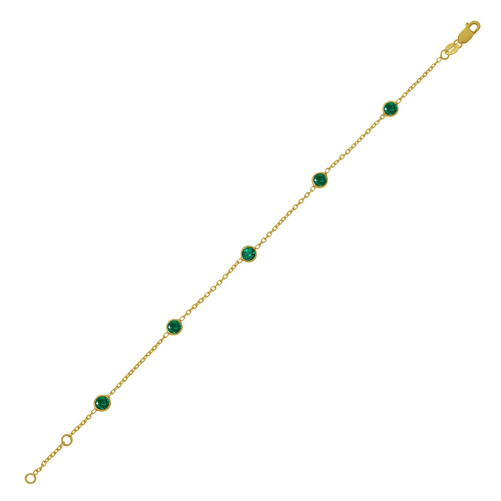 14k yellow gold modern bracelet featuring emerald stations on a delicate chain for a luxurious touch.