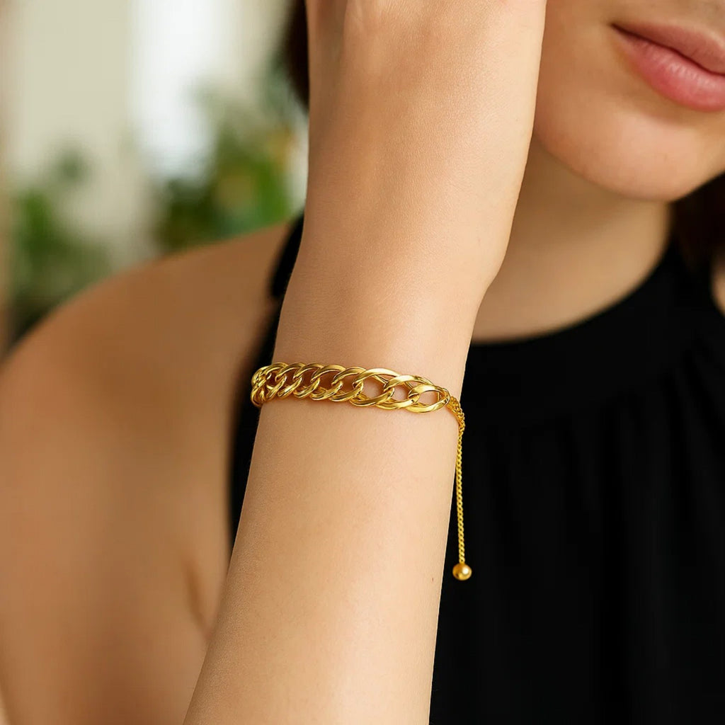 Adjustable 14k yellow gold chain bracelet featuring a modern round design, perfect for elegant layering.