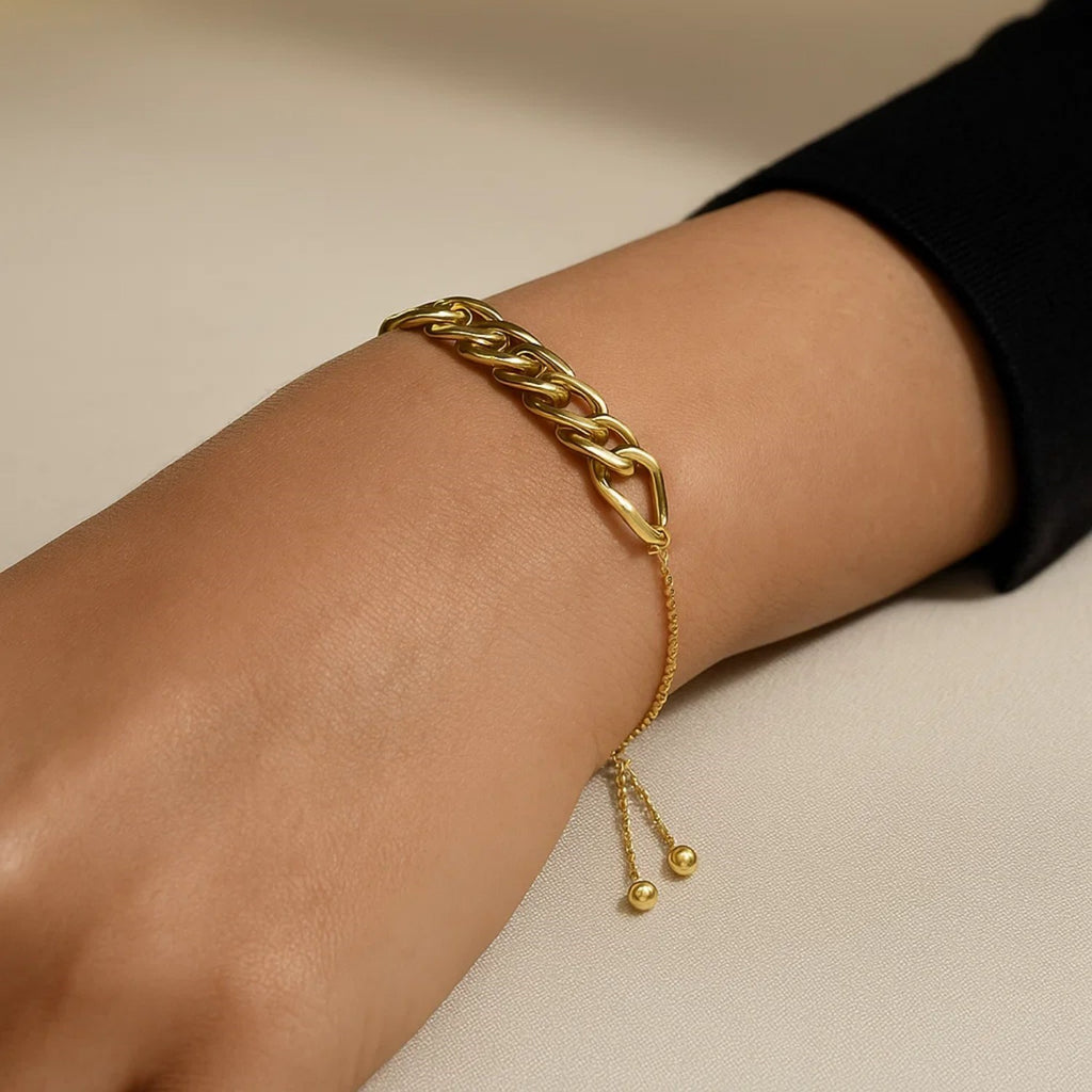 Adjustable 14k yellow gold chain bracelet featuring a modern design with elegant round links, perfect for layering.