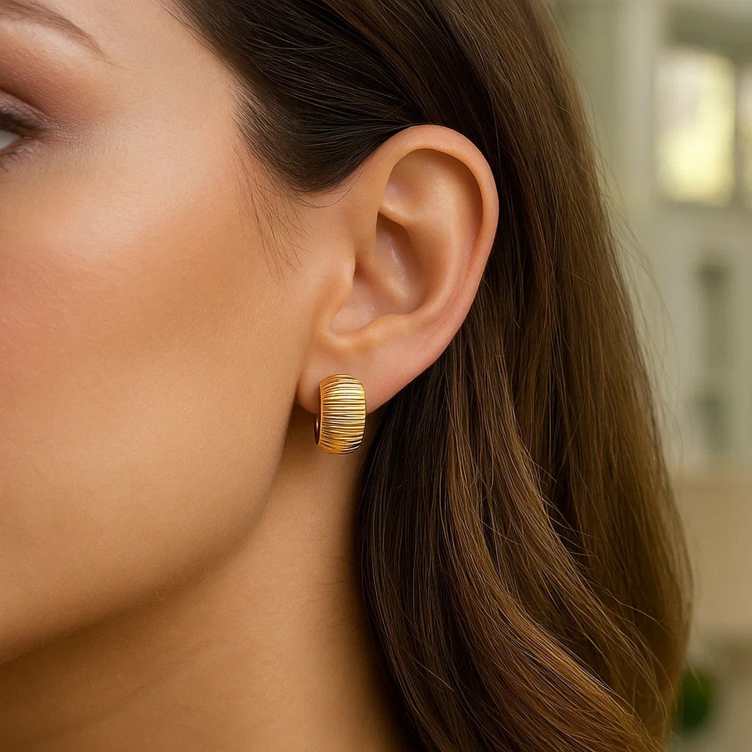 Elegant 14k yellow gold diamond cut hoop earrings showcasing exquisite craftsmanship and timeless style.