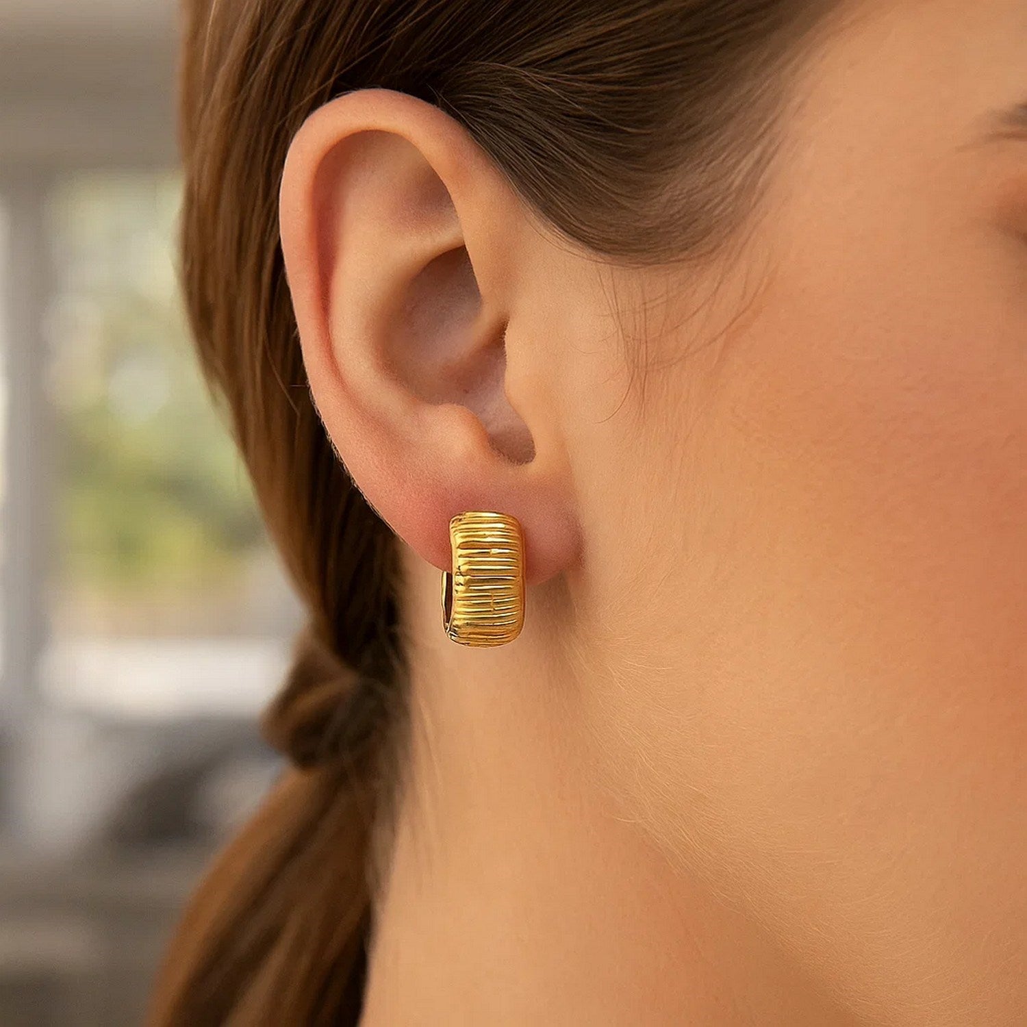 Elegant 14k yellow gold diamond cut hoop earrings showcasing exquisite craftsmanship and timeless style.
