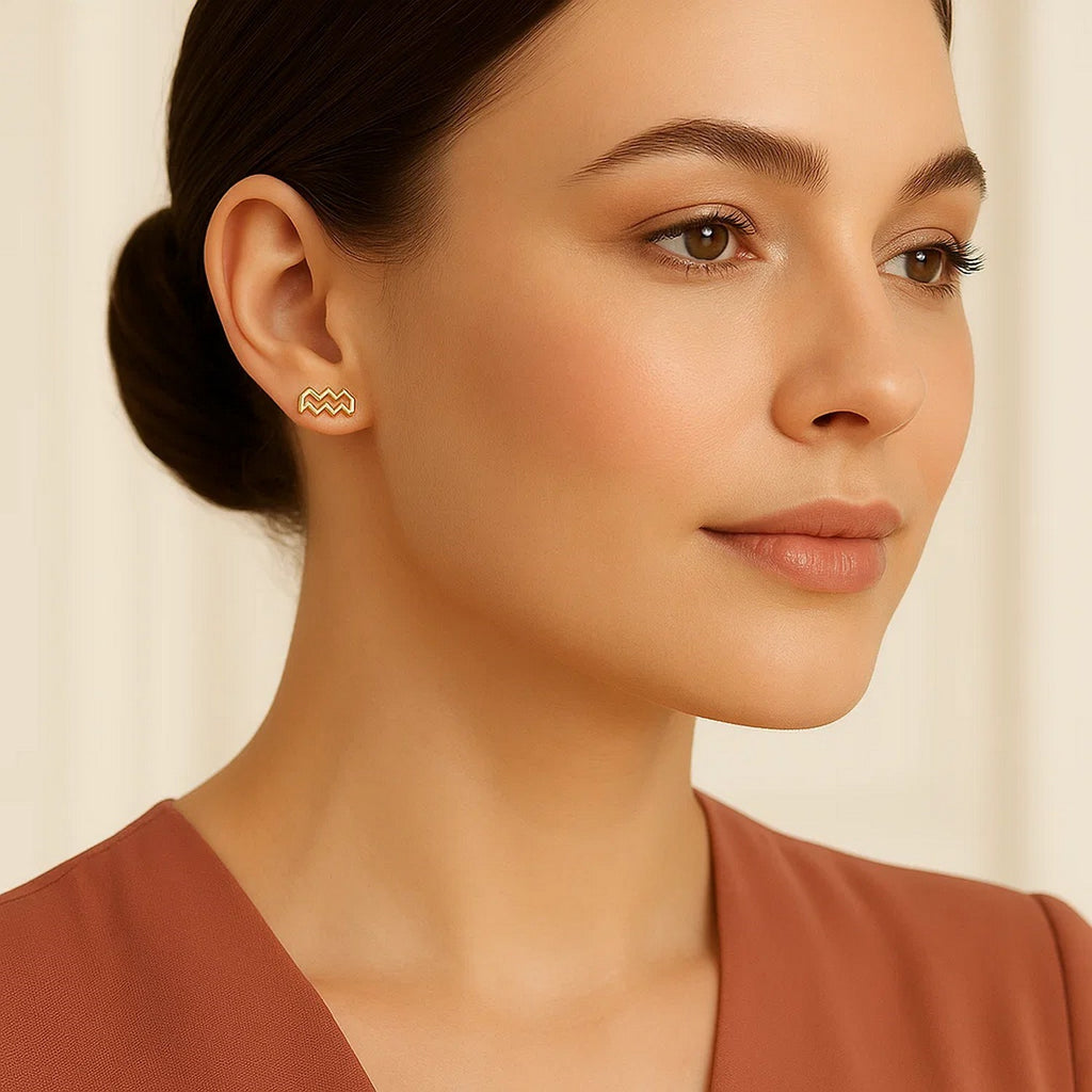 14k yellow gold modern stud earrings featuring a sleek design, perfect for elegant everyday wear.