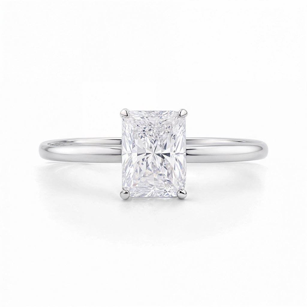 1 1/2 carat radiant lab-grown diamond solitaire ring in 14k white gold, featuring a modern prong setting.